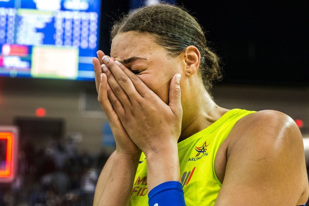 Dallas Wings center Liz Cambage (8) cries after the game against the Las Vegas Aces at...