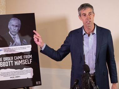 Beto O'Rourke, Democratic candidate for governor, stands next to an image of Texas Governor...