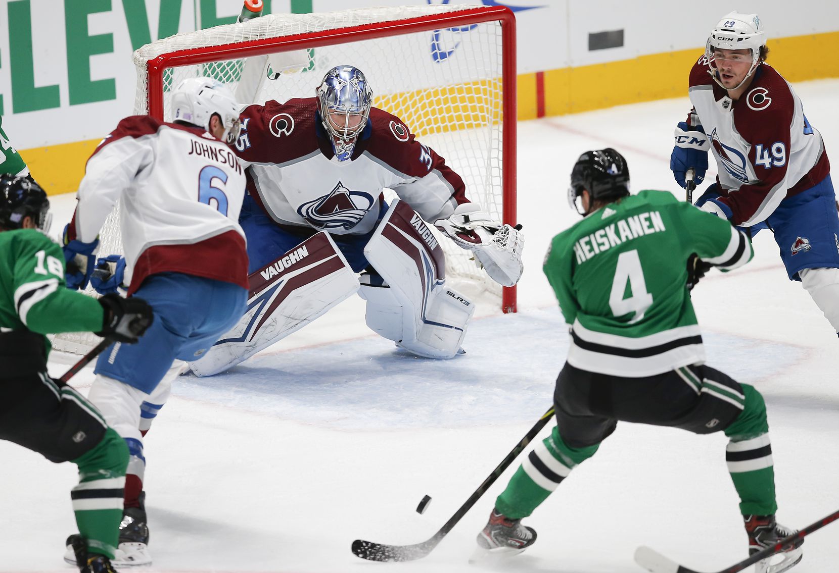 Dallas Stars defenseman Miro Heiskanen (4) attempts a shot as Colorado Avalanche goaltender Darcy Kuemper (35) defends during the first period of an NHL hockey game in Dallas, Friday, November 26, 2021. (Brandon Wade/Special Contributor)