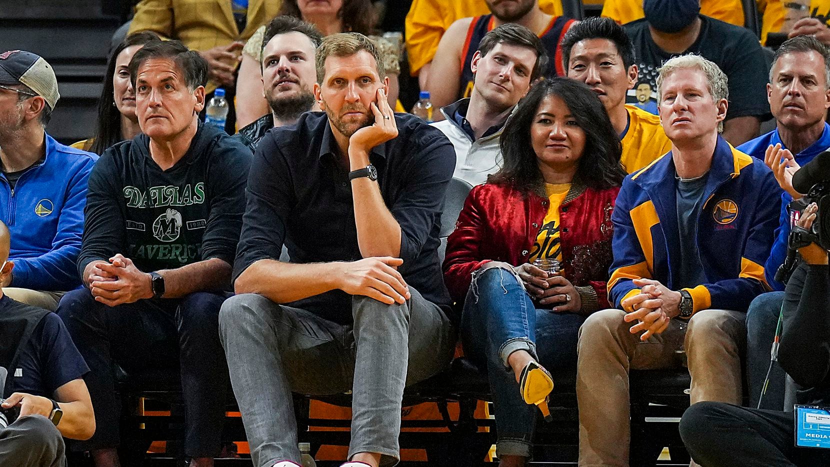 Dallas Mavericks owner Mark Cuban and former player Dirk Nowitzki watch from the front row...