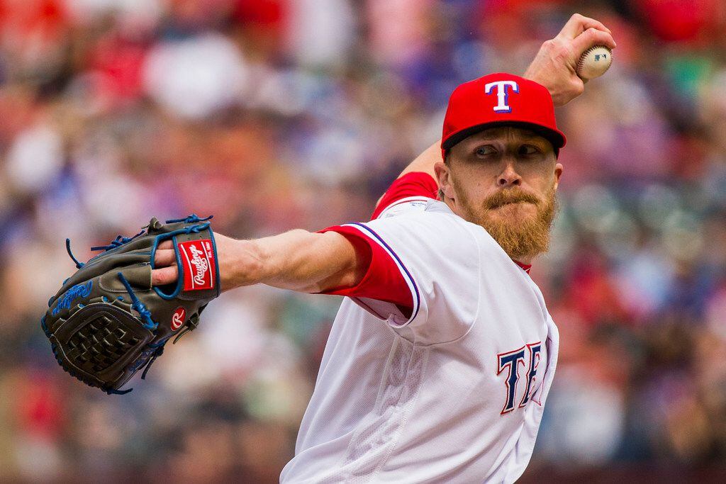 Texas Rangers relief pitcher Jake Diekman pitches during the seventh inning against the...