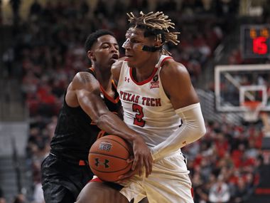 Oklahoma State's Avery Anderson III (0) tries to steal the ball away from Texas Tech's Jahmi'us Ramsey (3) during the first half of a game on Saturday, Jan. 4, 2020, in Lubbock.