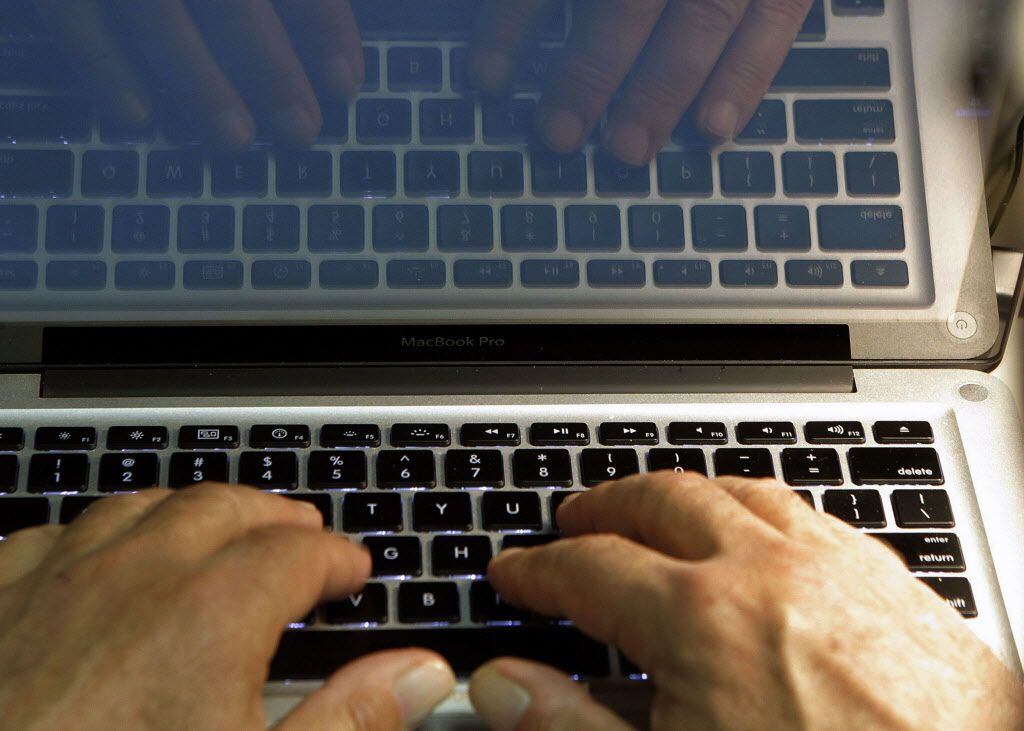 In this Feb. 27, 2013, file photo illustration, hands type on a computer keyboard in Los...