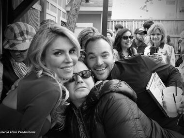 Reality star Brandi Glanville poses with fans during a book signing at the Grapevine Bar. 