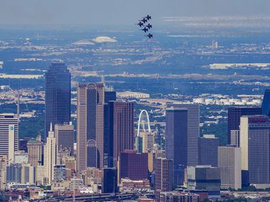 The U.S. Navy Blue Angels fly over the downtown Dallas skyline on Wednesday, May 6, 2020. ...
