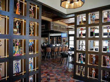 Inside the doors of Odelay in Dallas, 50 La Catrinas are on display. Restaurant co-owner...