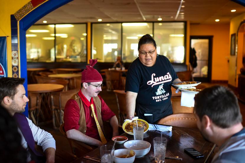 Mari Gomez serves lunch at Luna’s Tortillas y Hacienda in Dallas on Friday, Oct. 29, 2021.