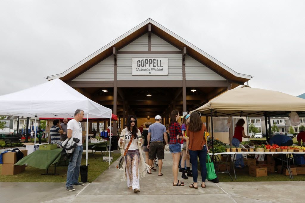 People shop for goods at the Coppell Farmers Market in Coppell