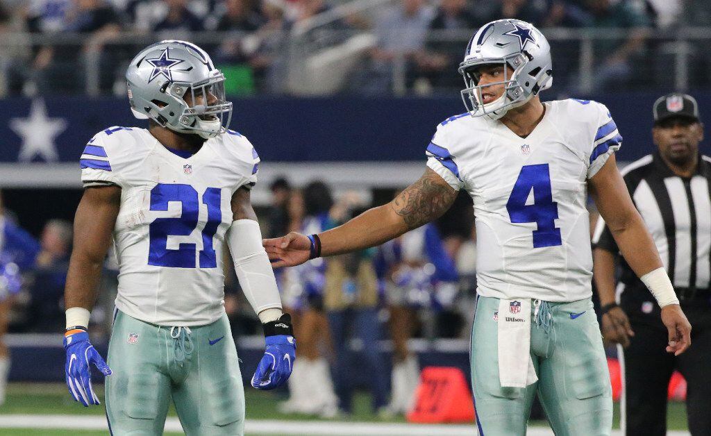Dallas Cowboys running back Ezekiel Elliott (21) and quarterback Dak Prescott (4) are pictured during the Tampa Bay Buccaneers vs. the Dallas Cowboys NFL football game at AT&T Stadium in Arlington, Texas on Sunday, December 18, 2016.