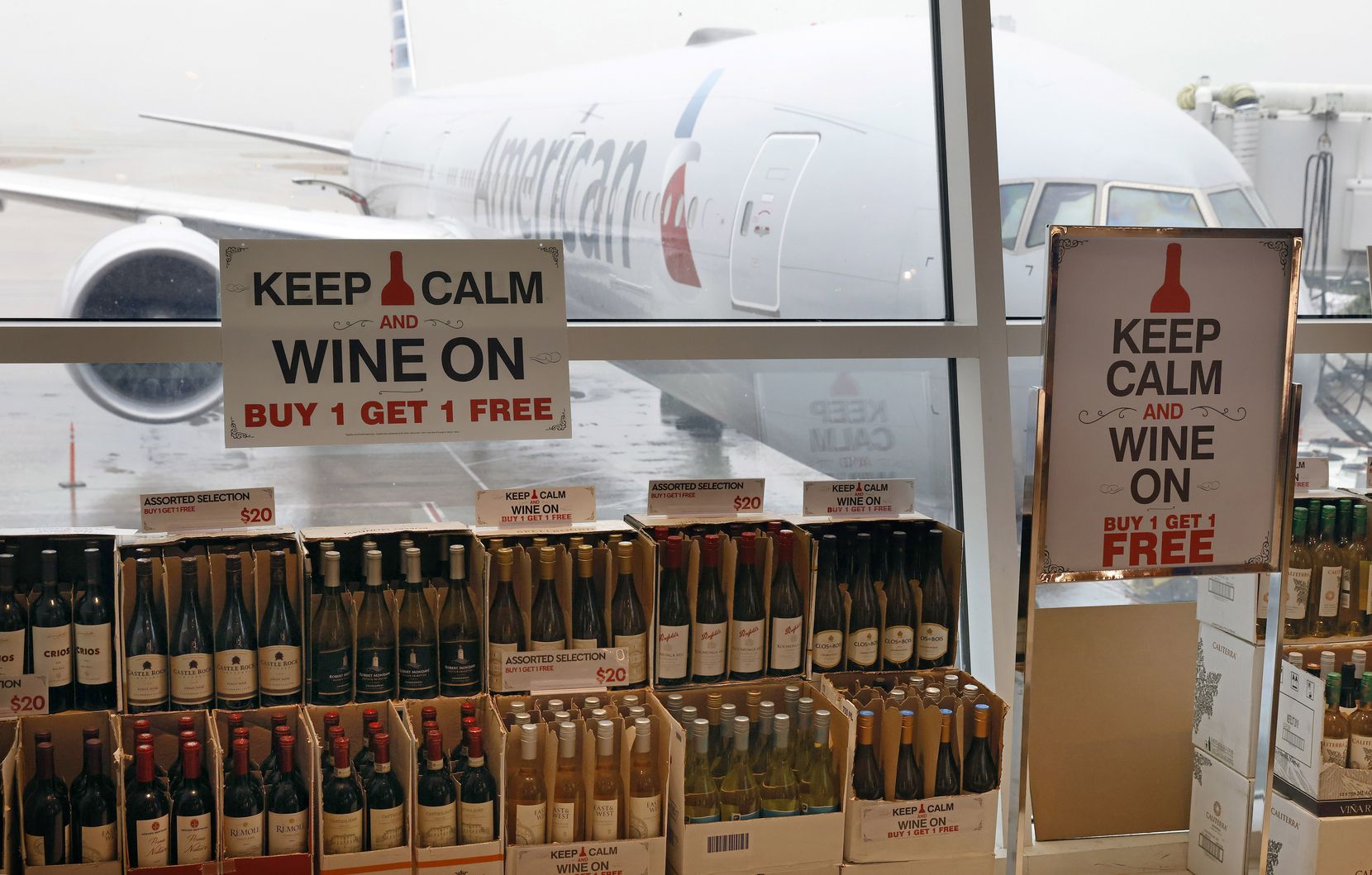 Boxes of wine are buy one, get one free at the TRG Duty Free shop in Terminal D.