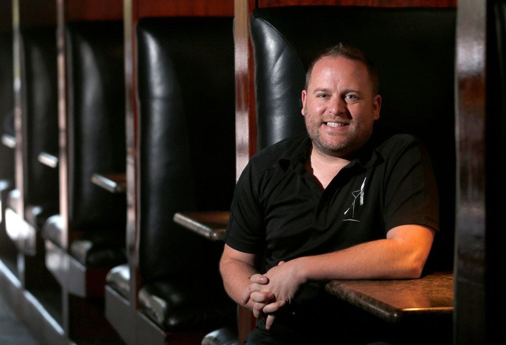 Lee Daugherty, owner of Alexandre's bar, poses for a portrait inside the bar in Dallas on...