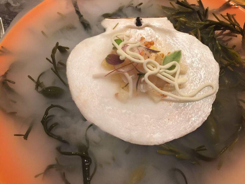Scallop crudo with pineapple, chipotle buckwheat groats and coconut, as it was served one...