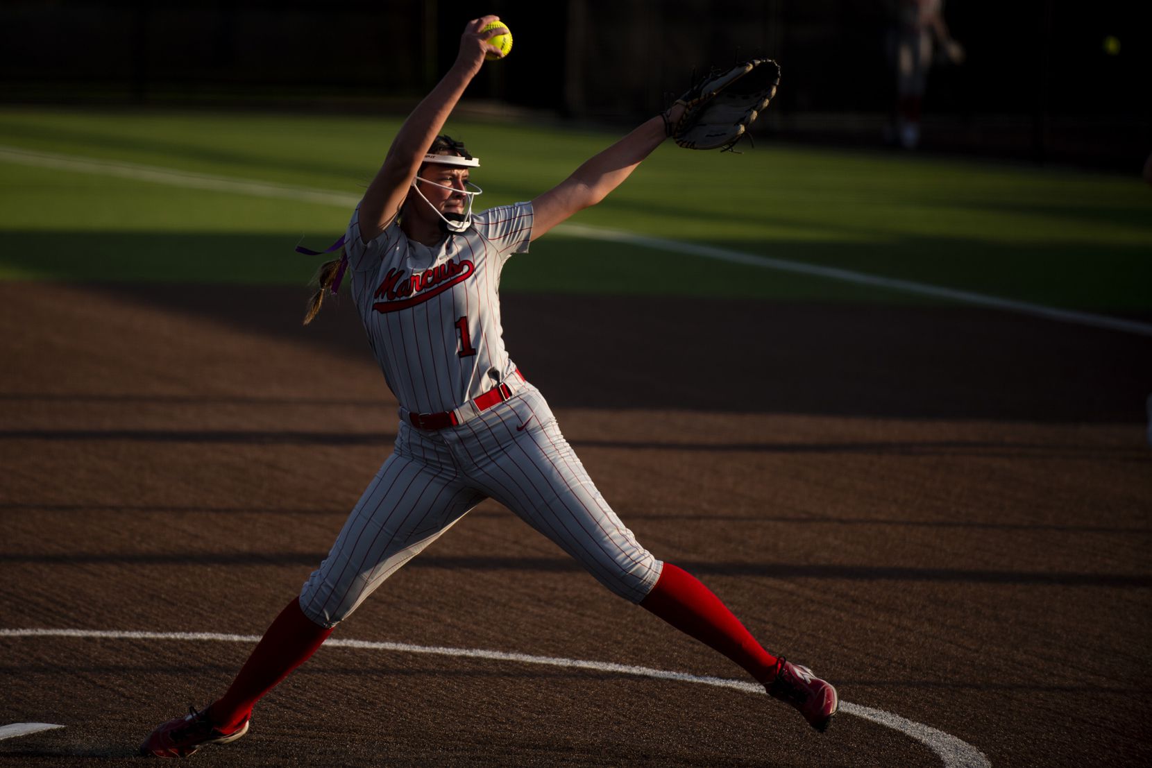 Flower Mound Marcus junior Faith Drissel (1) delivers a pitch during Game One of the Class...