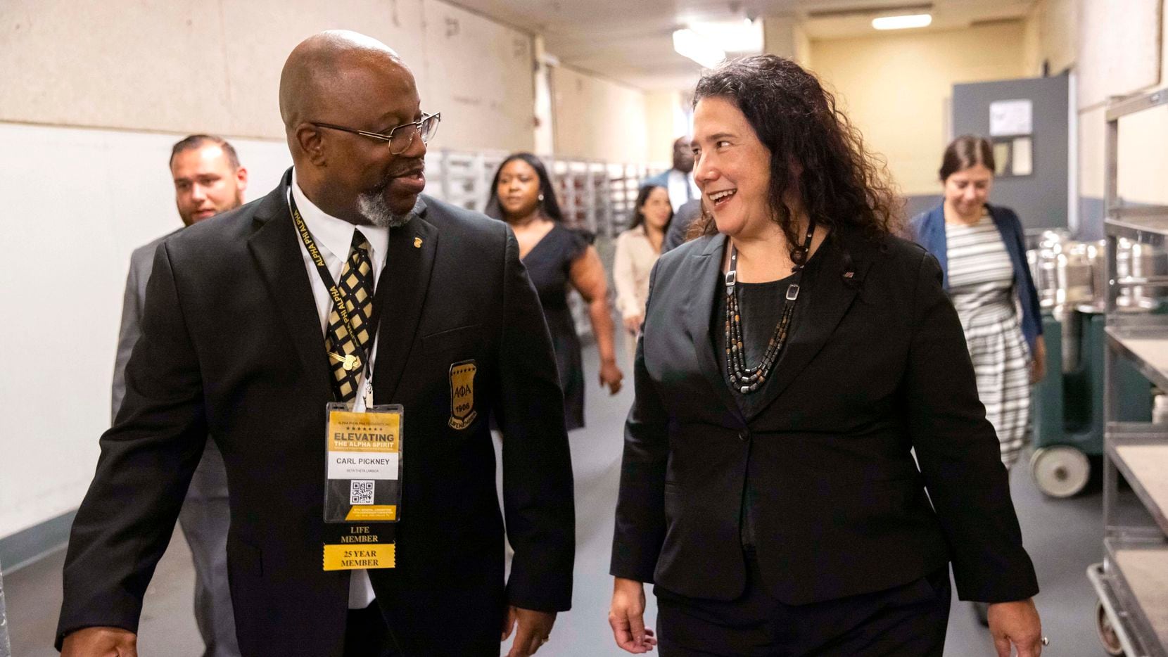 SBA Administrator Isabella Casillas Guzman (right) chats with Carl Pickney while being...