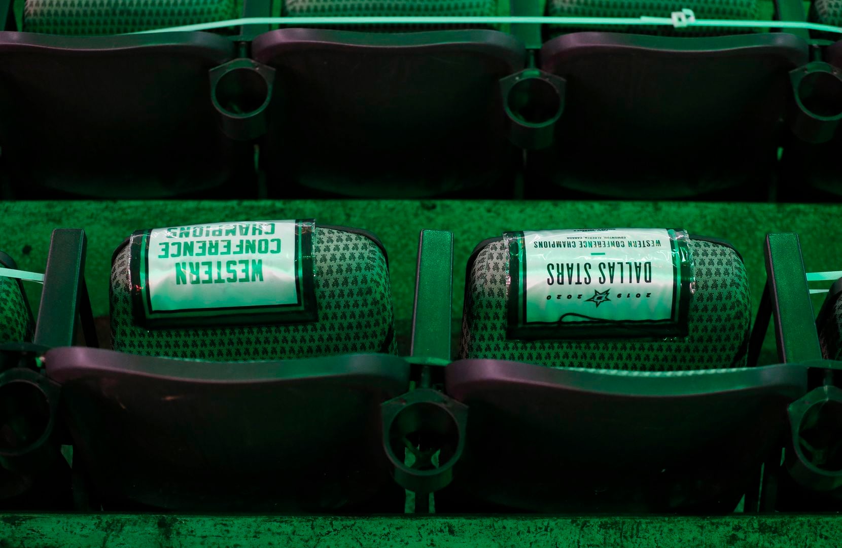 Banner replicas rest on a seat available for fans prior to the start of the Dallas Stars...