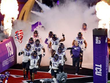 TCU Horned Frogs head coach Sonny Dykes and his players take the field to face the Georgia...