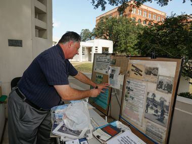 Mark A. Oakes, a JFK assassination researcher, sets up his display at Dealey Plaza. Oakes...