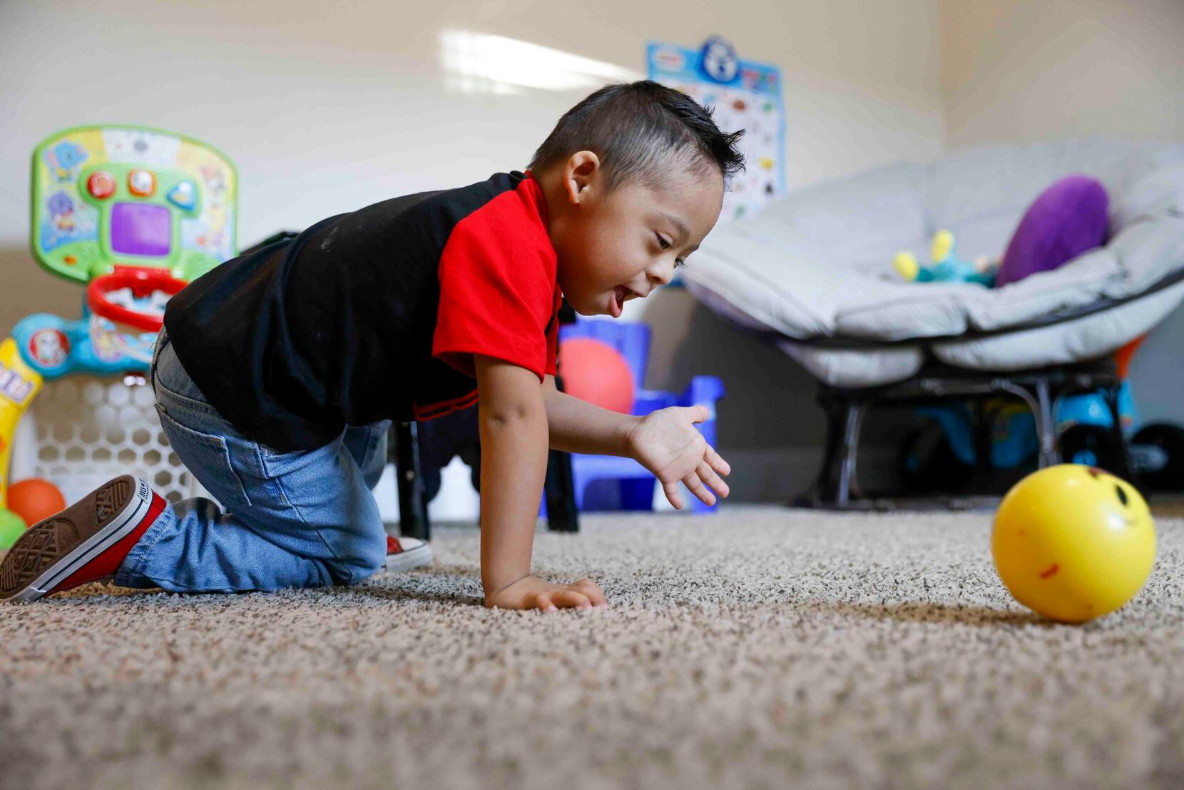 Pablo Chacón, 3, frolics in his playroom at his residence on Friday, Jan. 20, 2023 in...