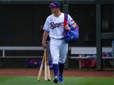 Texas Rangers infielder Nick Solak takes the field before a spring training game against the...
