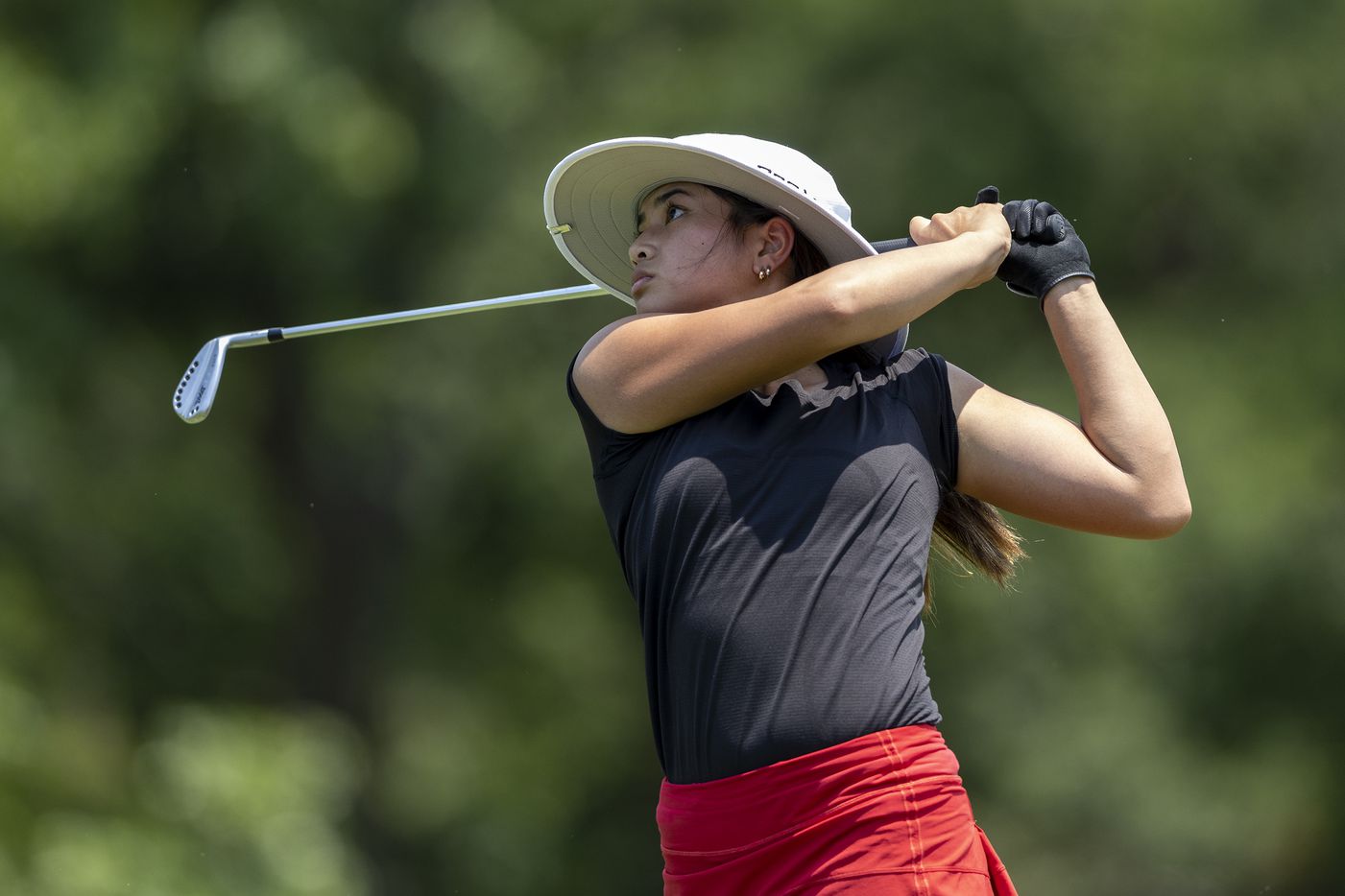 Coppell’s Kristin Angosta hits from the 8th tee box during the 6A girls state golf...