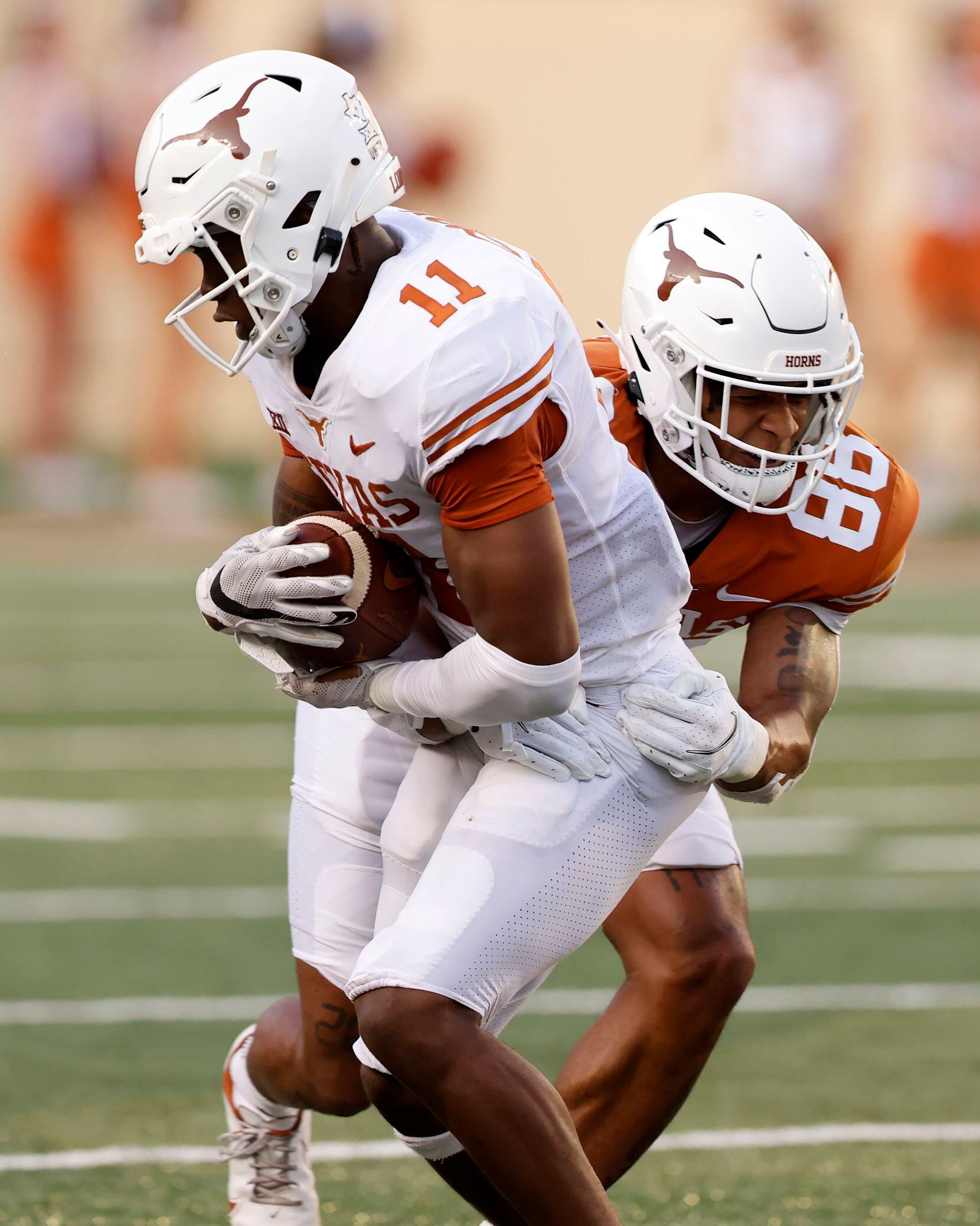 Texas Longhorns defensive back Anthony Cook (11) intercepts a pass thrown by quarterback...