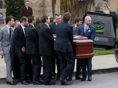 Pallbearers carry a casket of Brian Loncar to a hearse following his funeral at Munger Place...