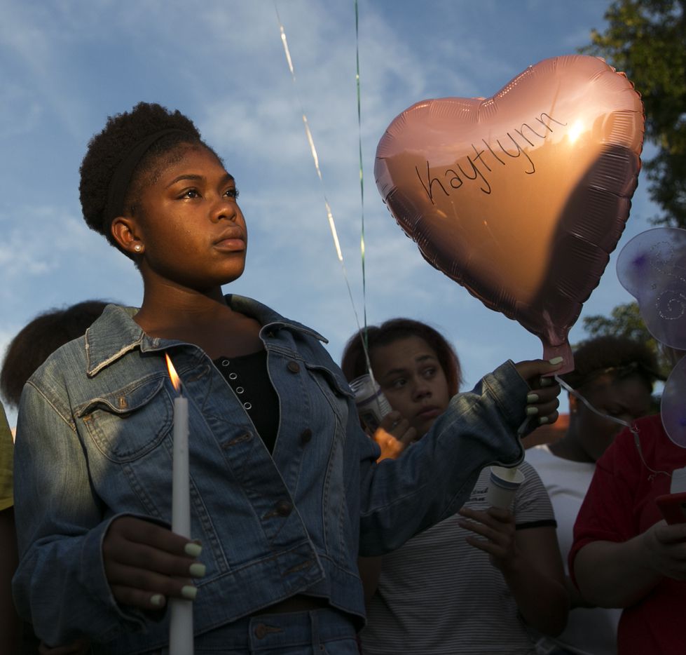 Tracarria Camper, 13, holds a balloon and candle during a prayer vigil held in honor of Kaytlynn Cargill at Central Junior High School in Euless on Thursday.