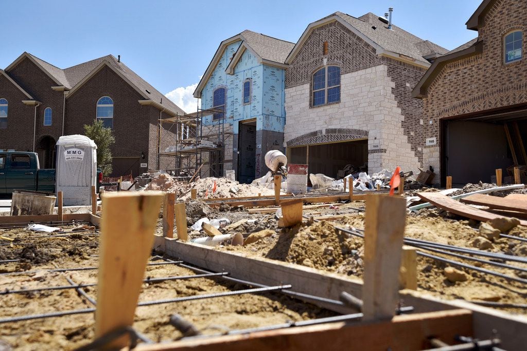 Construction sites for Lennar Homes sit at the subdivision University Place in north Dallas...