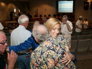 
Irving Mayor Beth Van Duyne (center) was met with hugs from supporters at City Hall on Saturday after her victory over Herbert Gears.



