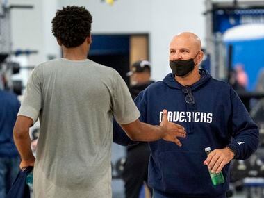 Dallas Mavericks head coach Jason Kidd shakes hands with forward Feron Hunt during a...