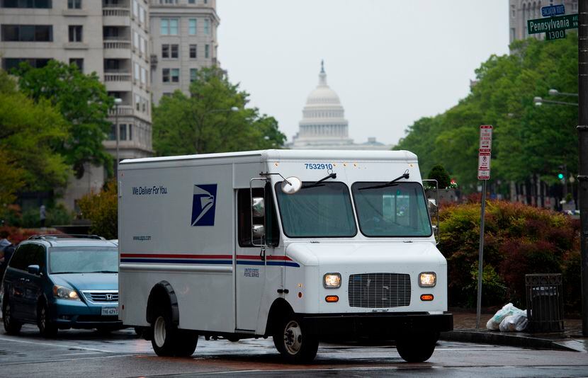 A U.S. Postal Service truck drives down Pennsylvania Avenue in Washington, D.C. on April 23.