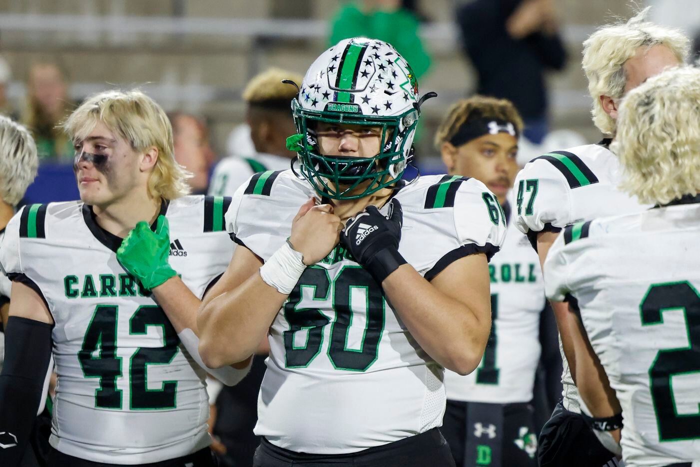 Southlake Carroll offensive lineman Jackson Underwood (60) watches as Duncanville celebrates after their Class 6A Division I state semifinal playoff game at McKinney ISD Stadium in McKinney, Texas, Saturday, Dec. 11, 2021. Duncanville defeated Southlake Carroll 35-9. (Elias Valverde II/The Dallas Morning News)