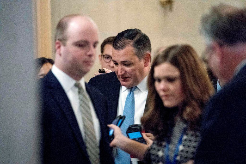 Sen. Ted Cruz, R-Texas, speaks to reporters as he arrives as Republican senators gather to meet with Senate Majority Leader Mitch McConnell, R-Ky., on the GOP effort to overhaul the tax code, on Capitol Hill, Friday, Dec. 1, 2017, in Washington. (AP Photo/Andrew Harnik)