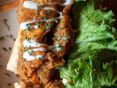 Fishin' Good Banh Mi with fried Swai tossed in Cajun seasoning served with fixings and house mayo, from Cris and John Vietnamese Street food restaurant in Dallas, on Sept. 21, 2021. 