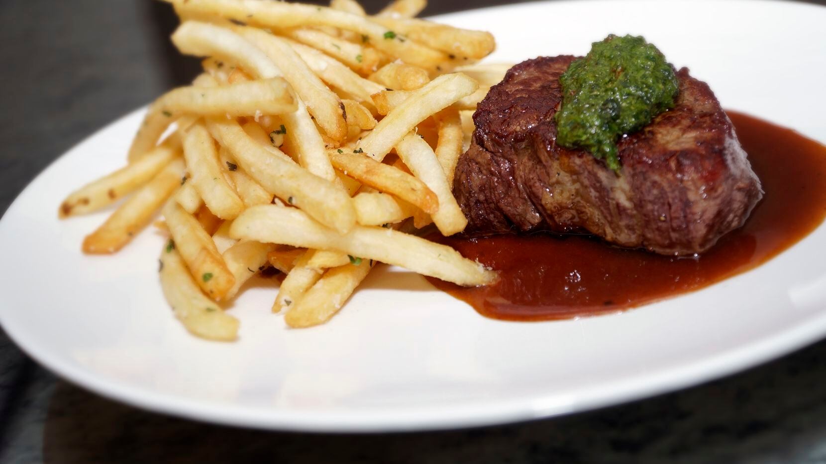 Steak frites are a popular lunch order at Wicked Butcher in the Sinclair Hotel in downtown...