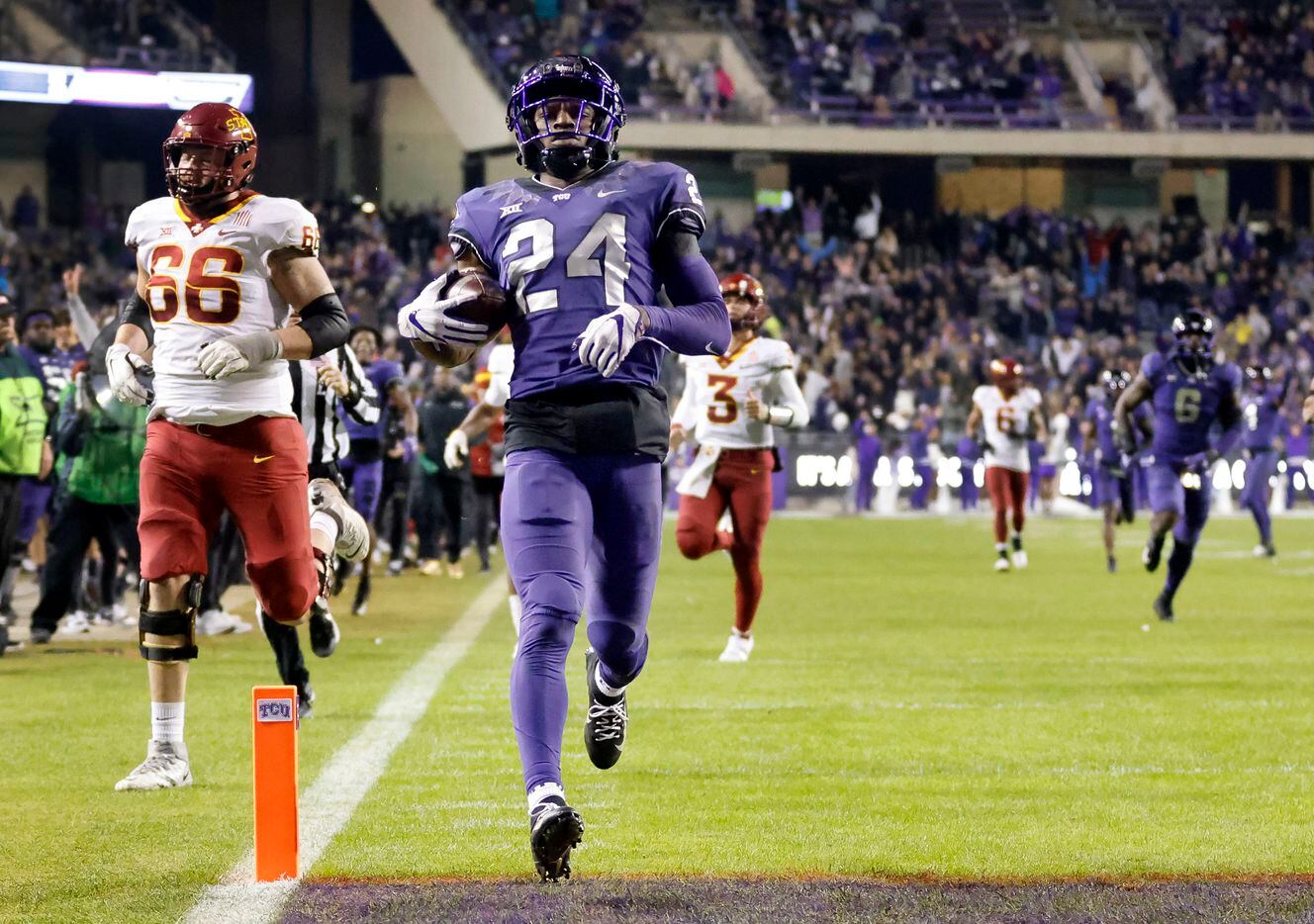 TCU Horned Frogs cornerback Josh Newton (24) crosses the goal line for a touchdown after...