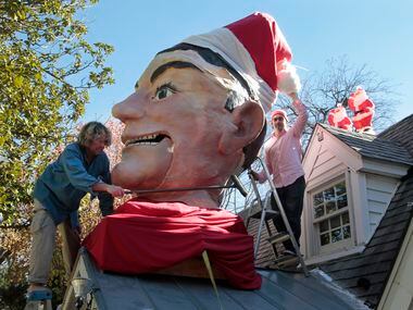 In 2012, Wayne Smith and his neighbor Joe England installed a Santa Claus cap on Big Tex.