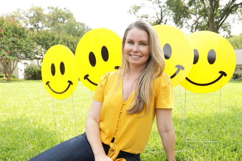 Chelsea Davenport of Richardson got the pick-me-up she needed from a smiley-face sign near a...