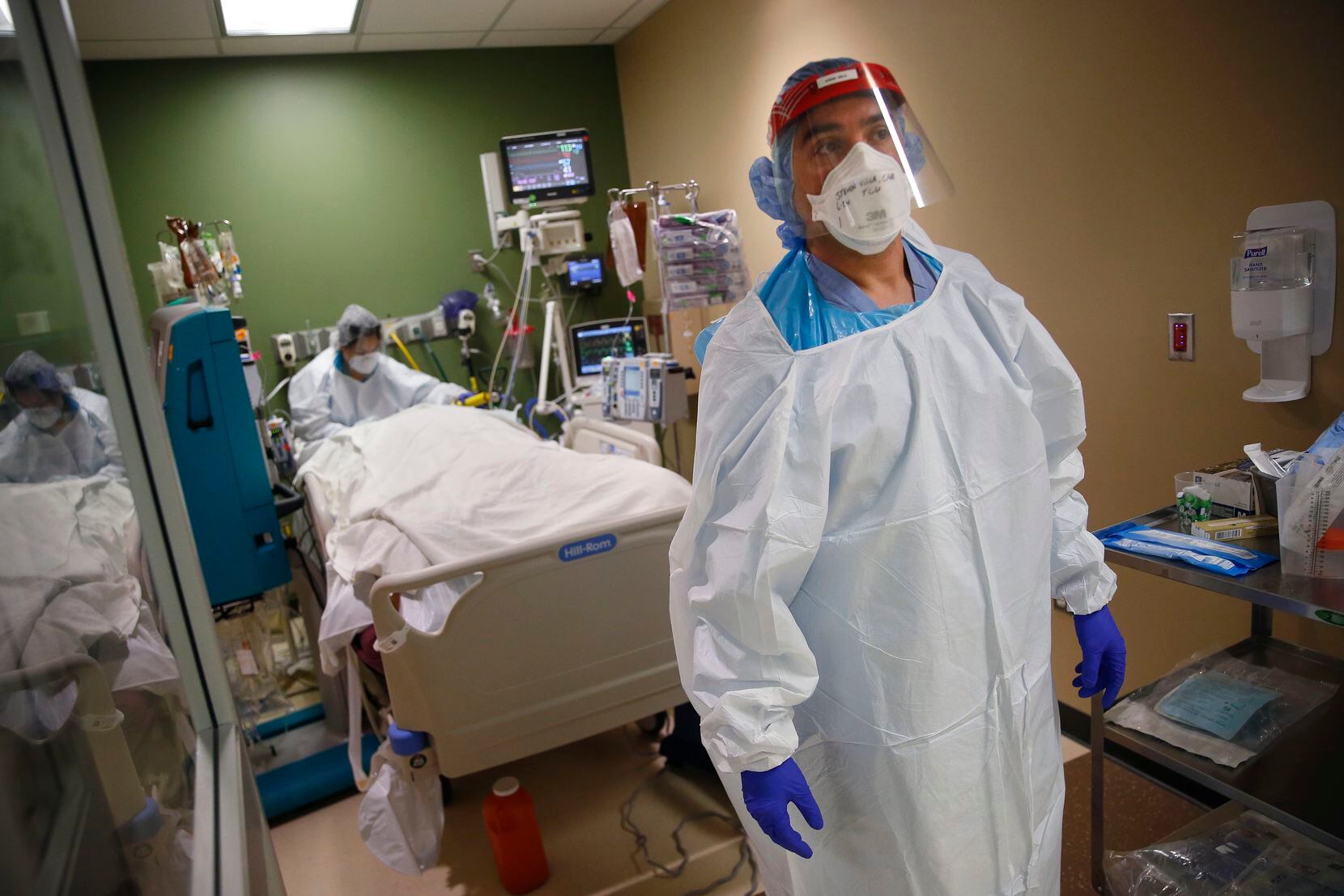 Certified Registered Nurse Anesthetist Steven Vela calls out for an extra set of hands as he...