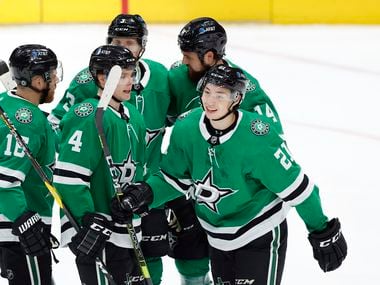 Dallas Stars left wing Jason Robertson (21) is congratulated by teammates after scoring a first period goal against the Florida Panthers at the American Airlines Center in Dallas, Tuesday, April 13, 2021.