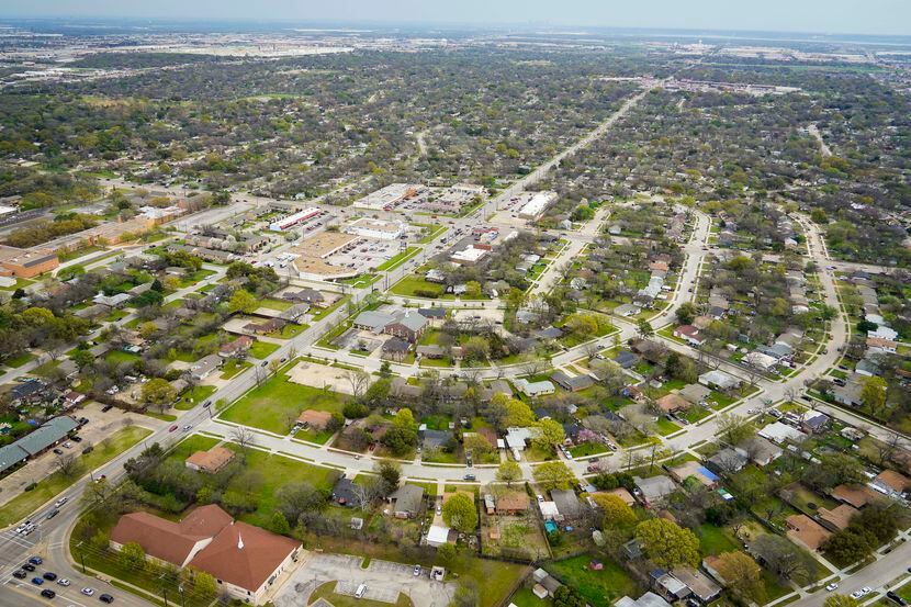 Aerial view of residential neighborhoods and retail on Thursday, March 12, 2020, in...