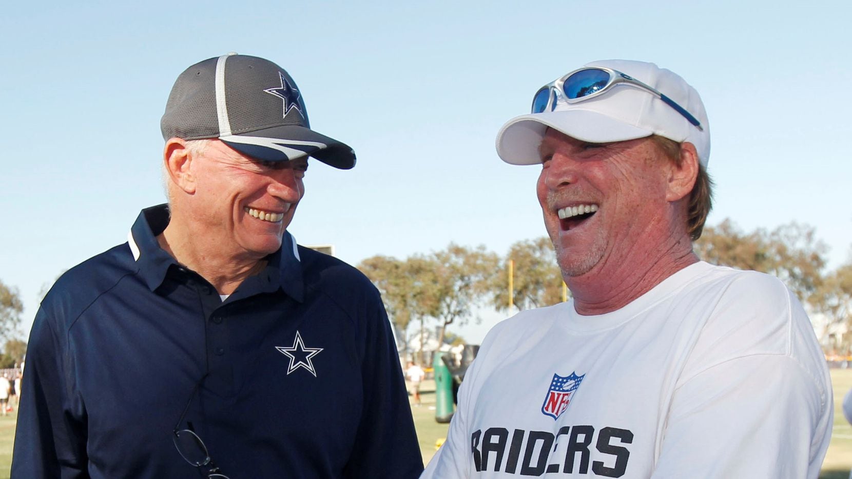 Dallas Cowboys owner Jerry Jones greets Oakland Raider owner Mark Davis (right) during their...