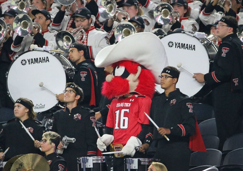 The Red Raiders mascot sits in with the Red Raider band drum line in the second quarter...