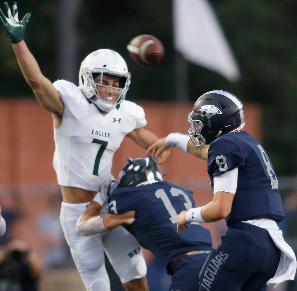 Prosper's Mason Jolley (7) leaps and narrowly misses blocking a first half pass by Flower...
