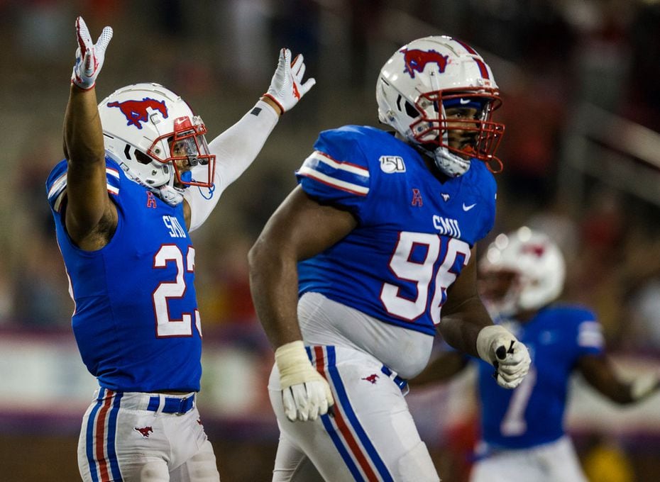 SMU Mustangs safety Rodney Clemons (23) and defensive tackle Zach Abercrumbia (96) celebrate...