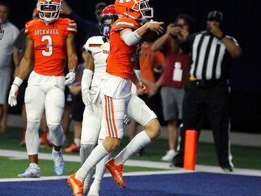 Rockwall High School quarterback Mason Marshall (16) carries the ball in for his third...