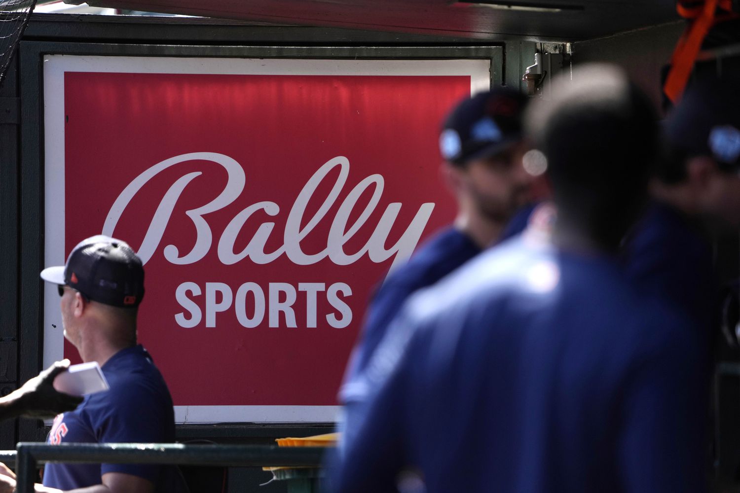 A Bally Sports sign hung in a dugout before the start of a March 2023 spring training...