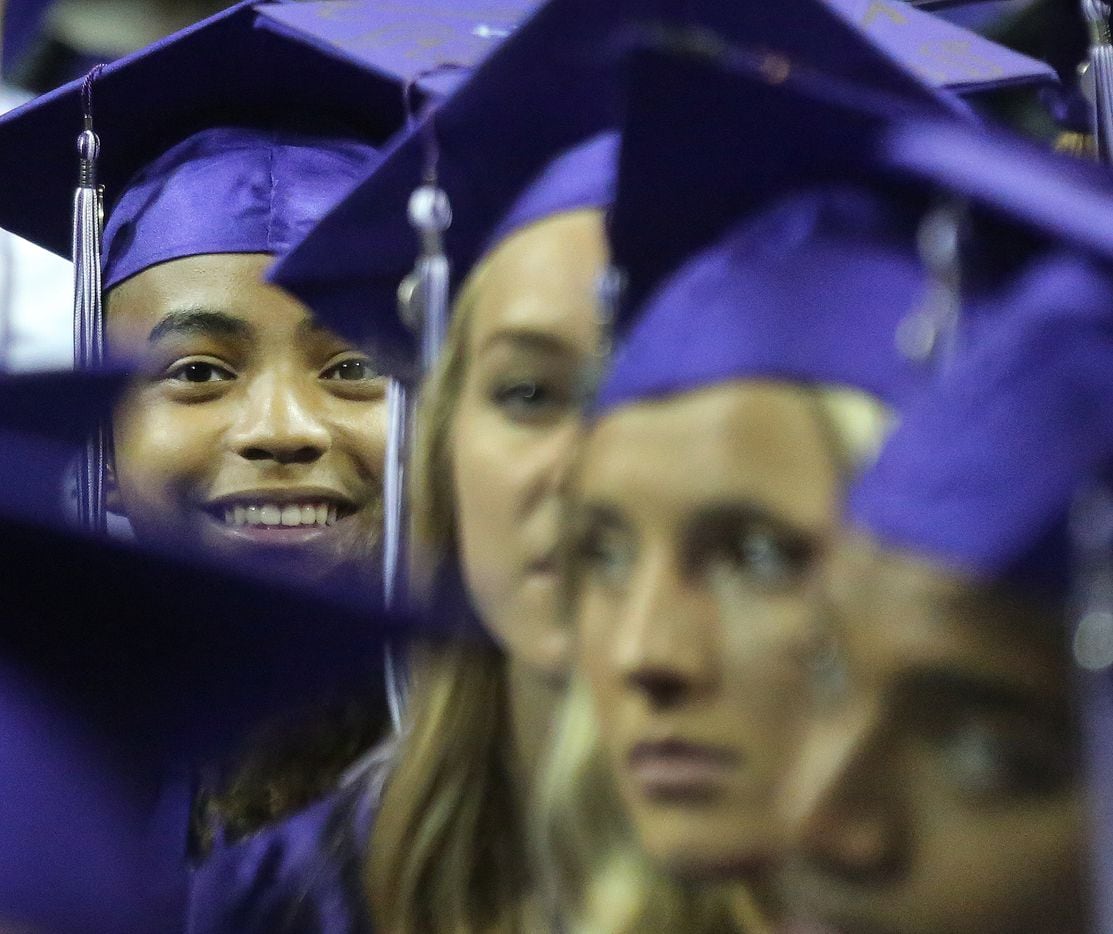 14-year-old Carson Huey-You is pictured in the crowd of graduates as he prepares to receive...