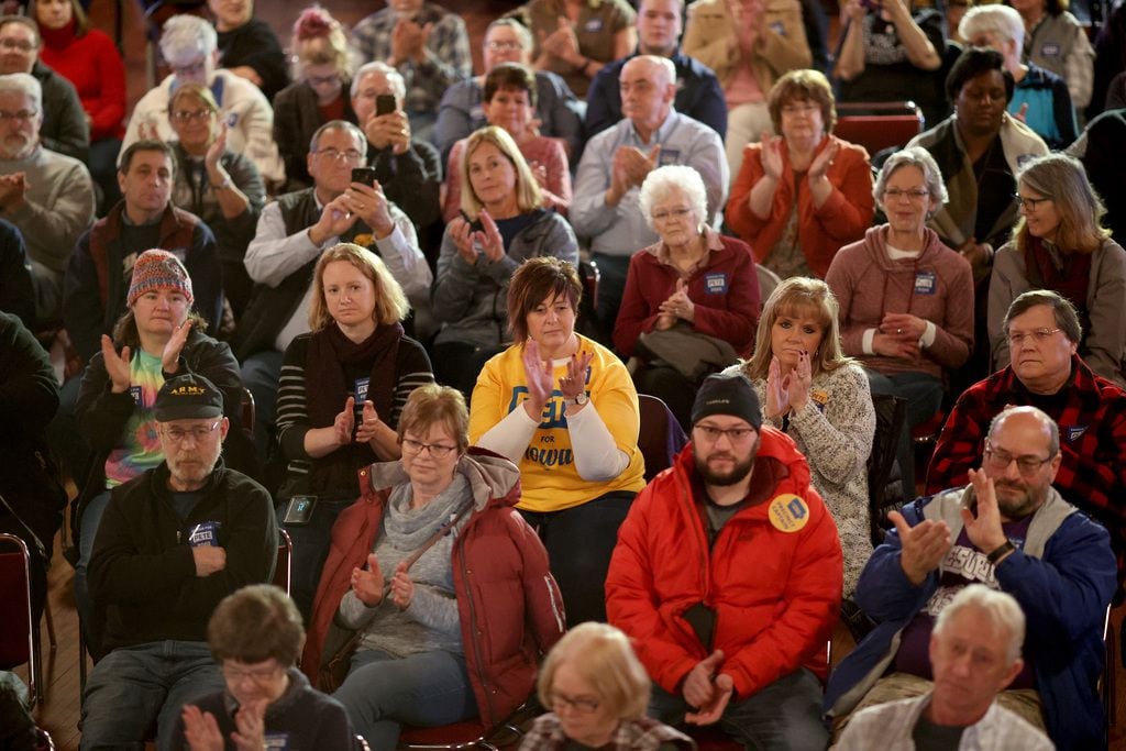 Iowans listen to Pete Buttigieg at a rally Feb. 1, 2020, in Oelwein, Iowa.