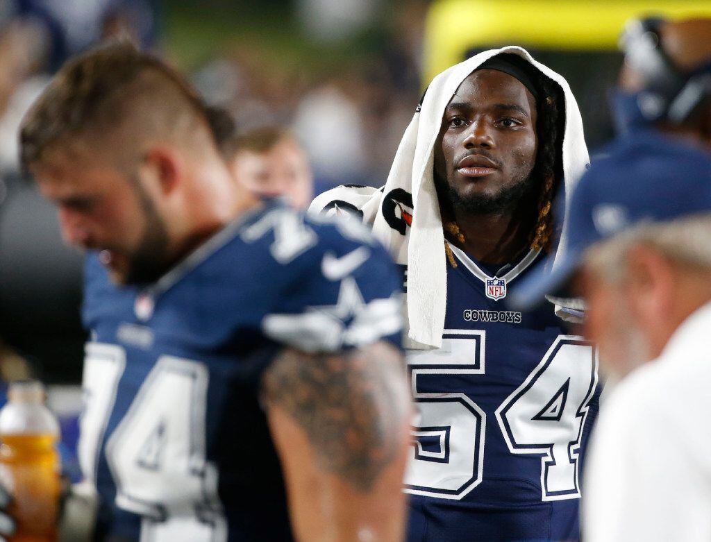 Dallas Cowboys outside linebacker Jaylon Smith (54) looks at the screen while on the...